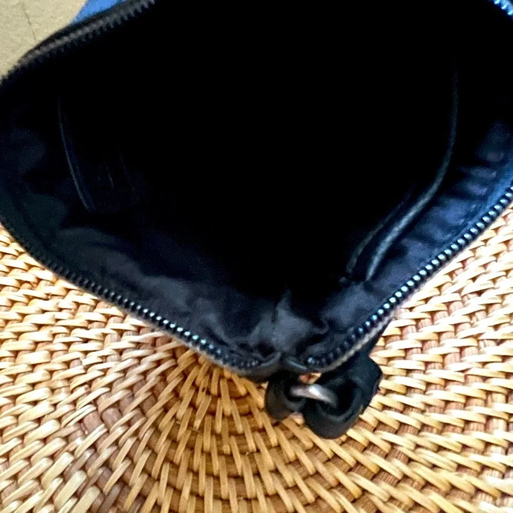 Calvin Klein black zip wristlet pouch with sparkly CK lettering